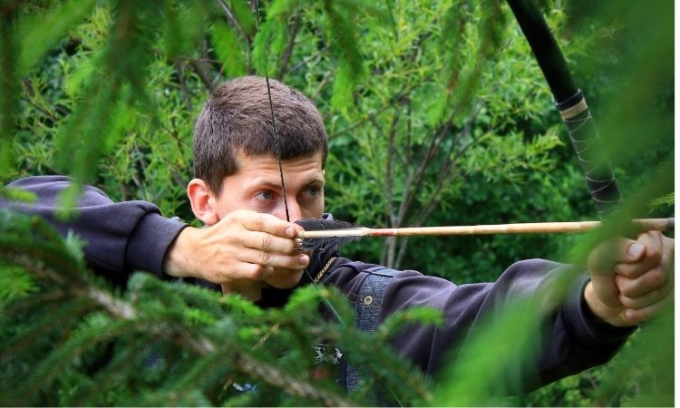 How should you hold a bow and when shooting? 1